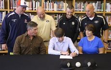 An attentive audience watched Greer High School’s Ethan Wortkoetter sign his grant-in-aid today at the library. Wortkoetter is flanked by his father, Bryan, and mother, Joni while the second row, left to right, are Dale Gosnell, Post 115 coach and Greer coaches Eric Moody, Kevin Gregory and head coach Bob Massullo.