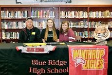 Ansel and Meri Gilreath celebrate Ansley's signing with Winthrop University.
 