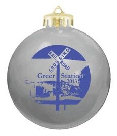 The 2014 Greer Station Association ornament was designed by The Image Forge. It is $10 and can be purchased through selected downtown merchants, including Kim’s Fabrics, Stomping Grounds, Greer Trading Post, Shoppes on Trade, Shear Faith and Maiale.