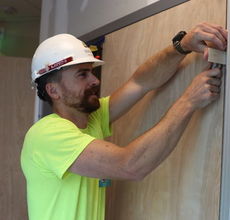 Kevin Bein of Mavin Construction works on the lounge at GSP.
 