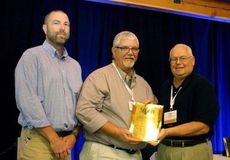Gas department manager Rob Rhodes (center) and Regulatory Compliance Supervisor Jonny Corley (left) accept Gold Award from APGA Board of Directors member Pat Riley.
 