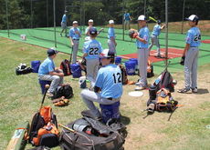 The Greer Nationals wait out a long delay as the Dixie Youth Championships earlier games pushed back the schedule Saturday.
 