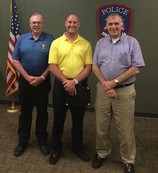 Det. Dale Arterburn, center, is the first beneficiary of the Greer Police Department Citizen's Police Academy Alumni Association, Cops Night Out, a partnership with Greer restaurants. Dale Haule, left, and Bill Bennett called on the restaurants for the gift cards.
 