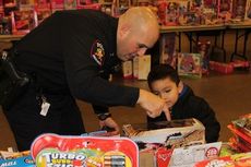 Officer Matt Cohen provides some important details about a toy.