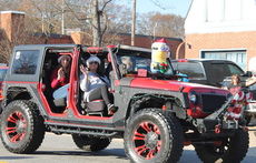 Vehicles are all dressed up for the Christmas Parade.
 