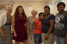First year Washington Center teacher, Melanie Montemayor (second from left) and staff welcome student Daria Jenkins and her family during Meet Your Teacher Afternoon.