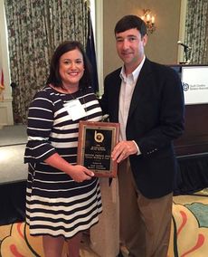 Jennifer T. Jones of Citizens Building and Loan received the SC Outstanding Young Banker of the Year award from 2015 recipient Montague Laffitte of South State Bank.
 