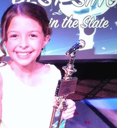 Julia Higginbotham, from Greer, won $200 and the first place trophy at the 