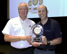 Manfred Erlacher, President and CEO of BMW Manufacturing Co., left, holds the J.D. Power Bronze Plant Quality Award in the Americas region presented to the Greer plant.
 
 
 