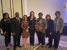 Mikelle Porter (third from left}) with Greenville Technical College colleagues left to right:  Tameka Brown, Dr. Jermaine Whirl, Allison Keck, Dia Robinson, Judy Wilson, and Beth Todd, receives the Chairman