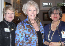 Co-founder Dr. Nancy Welch, center, talks with Gail Stokes, left and Diane Nelson.