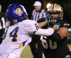 Noah Hannon, right, battles in the trenches Friday night.
 