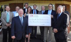 Front row: Paul J. Rogers/ CBL Chairman and Steve Hand/Director, Quick Jobs For The Future. Back row, left to right, are CBL Directors Ralph W. Johnson III, I. James Jr., W. Terry Dobson, Hayne P. Griffin Jr., Benjamin B. Waters III, Jennifer Jones and CBL Executive Vice President. Holding the check are: Mikelle Porter/Benson Campus Coordinator and J. Thomas Johnson, CBL President/CEO.
 