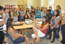Local artist Ashley Brickner came to Mrs. Cook's Art classes to help students with their self-portrait drawings.