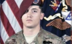 Photo of U.S. Army Pfc. Adam Ross displayed at  memorial service August 2 in Italy.