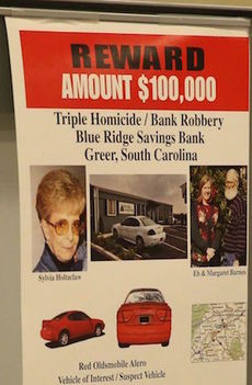 A poster still hangs at the Greer Police Department asking for information to the unsolved triple-murder and bank robbery at Blue Ridge Savings Bank in Greer.
 
