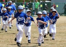 The boys of spring run to their positions during opening day ceremonies at the Parks and Recreation opening ceremonies at Century Park Field.