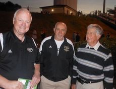 Keith Rumsey (center) and Leland Burch were among friends welcoming Marion Waters back to Dooley Field. 