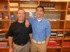 Zachri and his father-coach, Chad, pose for a special photo during Zachri's signing to wrestle at Limestone College.

 