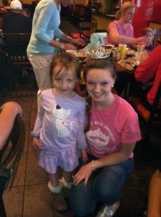 A young admirer caught the attention of Miss Blue Ridge Foothills Teen, Caroline Cavendish, during a fundraising event at Moe's restaurant in Greer.