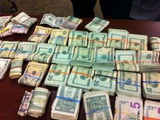 Greer police found $15,277 at the home of the suspect when they executed a search warrant.