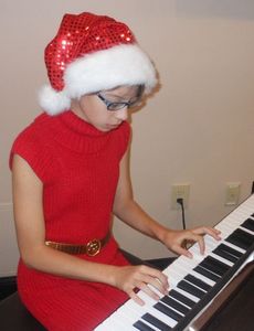 Jesi Heiser-Whatley was dressed for the holidays and entertaining the Breakfast with Santa guests today at the Cannon Centre.
