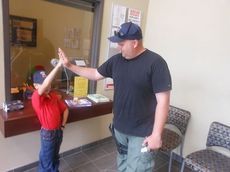 Sgt. Chad Richardson and Luke Sincavage exchange high fives after a busy day as partners. 