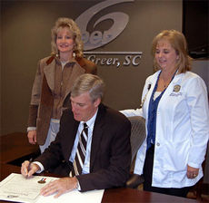 Nancy Durham, President & CEO of Mountain View Clinical Research in Greer, and Terry Williams, right, a Family Nurse Practitioner with the Greenville Hospital System, accepted the proclamation from Mayor Danner. Photo by Steve Owens / City of Greer