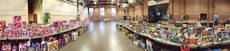 This panoramic view shows the quantity and organization of the toys waiting for boys and girls to make their selections.
