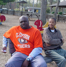A day in the park: Jimmy Vereen, left, and Harvey Scruggs talk basketball. Vereen will settle for Kentucky winning championship. 