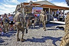 A United States Army soldier participates in a dance-off competition after the Pat Tillman run on Forward Operating Base Salerno after a Pat Tillman run in Afghanistan's Khost province.