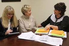 Shelley Kauffman, right, goes over the program for Thursday's Living Proof rally with Diane Wilson, left, and Wanda Davis.
 
 