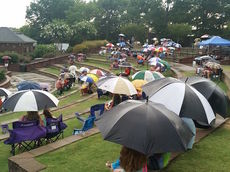 Umbrellas were needed for spectators during the early performance of Jim Quick and Coastline.
 