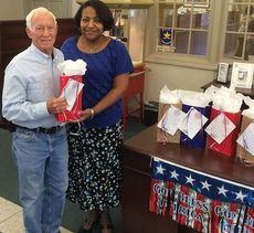 Linda Rorie presents a gift bag to veteran James 