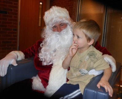 Santa listens intently as a young boy pauses to reflect on what he wanted for Christmas. He didn't want to leave anything off, especially since he had Santa's undivided attention.
 