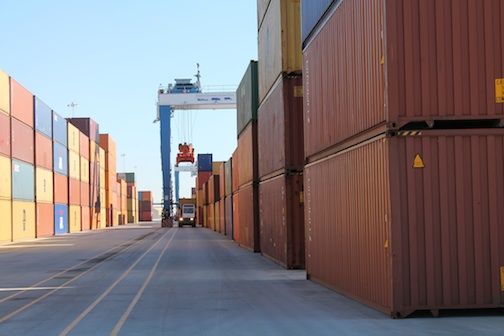 Containers, empty and occupied, form a wall between the rubber tiered gantry cranes. Empty containers may be stacked eight high and filled containers are limited to seven.
 
 
 