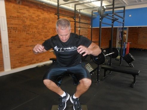 Drew Stewart demonstrates the box jump that will be part of the EFS training programs.
