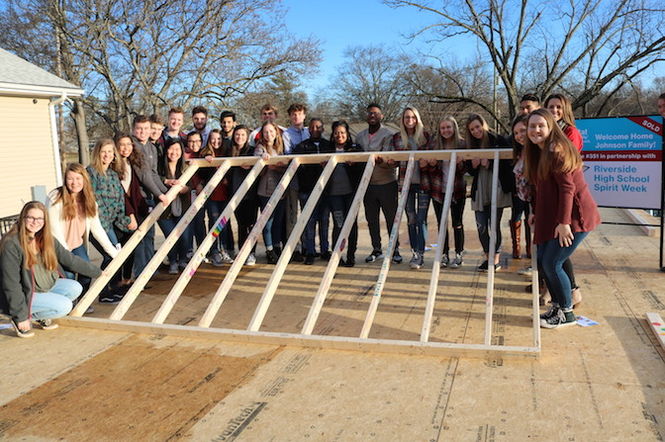 Riverside High School students, school leaders, Habitat Greenville team members and volunteers kicked off the RHS Spirit Week build by raising the walls of the home for future homeowner Kanya Johnson and her sons.