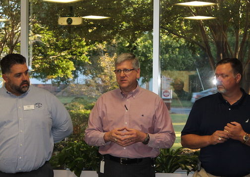 Jeff Tuttle, center, has resigned from Greer CPW to become CEO at Houston-based Heath Consultants Incorporated. Chuck Reynolds, CPW chief financial operator, is on the right.
 