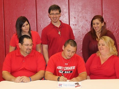 Tony Consolo, Jr. signs to play lacrosse at Belmont Abbey College. Attending the ceremony are his parents, Tony, Sr. and Andrea, and sisters and brother, left to right, Anastasia, Nicholas and Cheyenne.
 