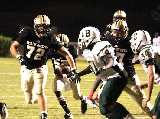 Alex Waters (92) clears a wide path for Greer's ballcarriers. 