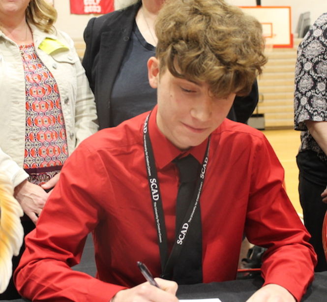 Austin Terault signed with Savannah College of Art and Design to run track.
 