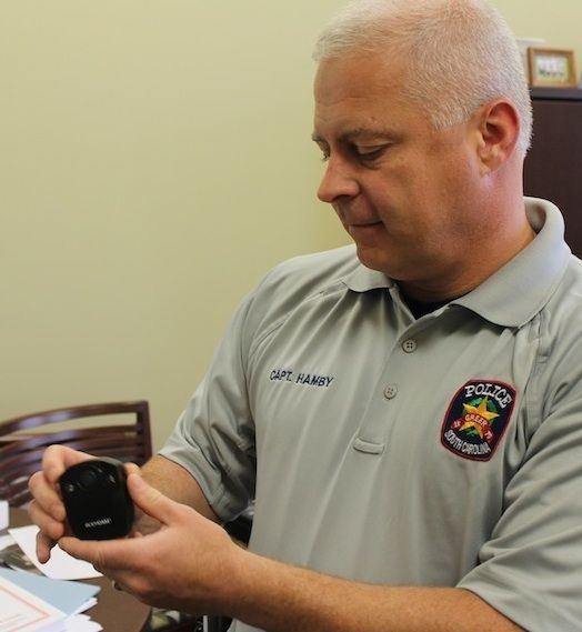 Captain Matt Hamby demonstrates the activation and recording of body worn cameras that have been put in use by the Greer Police Department.
 