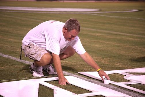Van Brannon lines up the templates for the painting. 