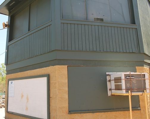 The age on the facility at Century Park is illustrated with two makeshift wooden rods holding the air conditioner in place. 
 
