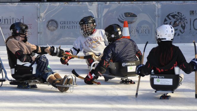 There are no holds barred in this sled hockey game at Greenville's Ice on Main.
 