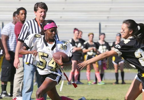 On the home page: Bree Burdette, 54, scoots around the defense during Thursday’s Greer High School powder puff football game. The juniors are in white jerseys and seniors in black. The referee is Robbie Gravely, the Voice of the Yellow Jackets.