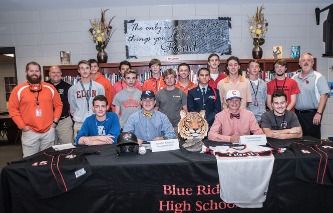 It's hard to figure out who is missing from this photo of signing day for Elijah Henderson and Brandon Southern.
 