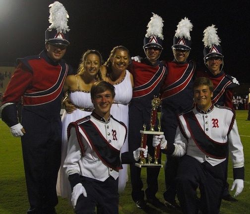 Band officers with the awards won by the marching band in the first competition of the season.
 
