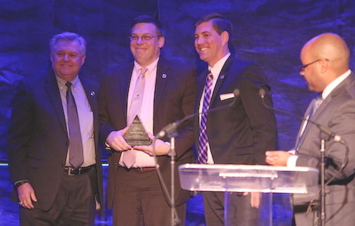 Timothy Joner, center, was awarded the Sud Padget Volunteer of the Year Award by Rudy Painter (sponsor Countybanc Insurance) and Mark Owens. Nigel Roberson, of WYFF-TV, the event's emcee, is on the right.
 